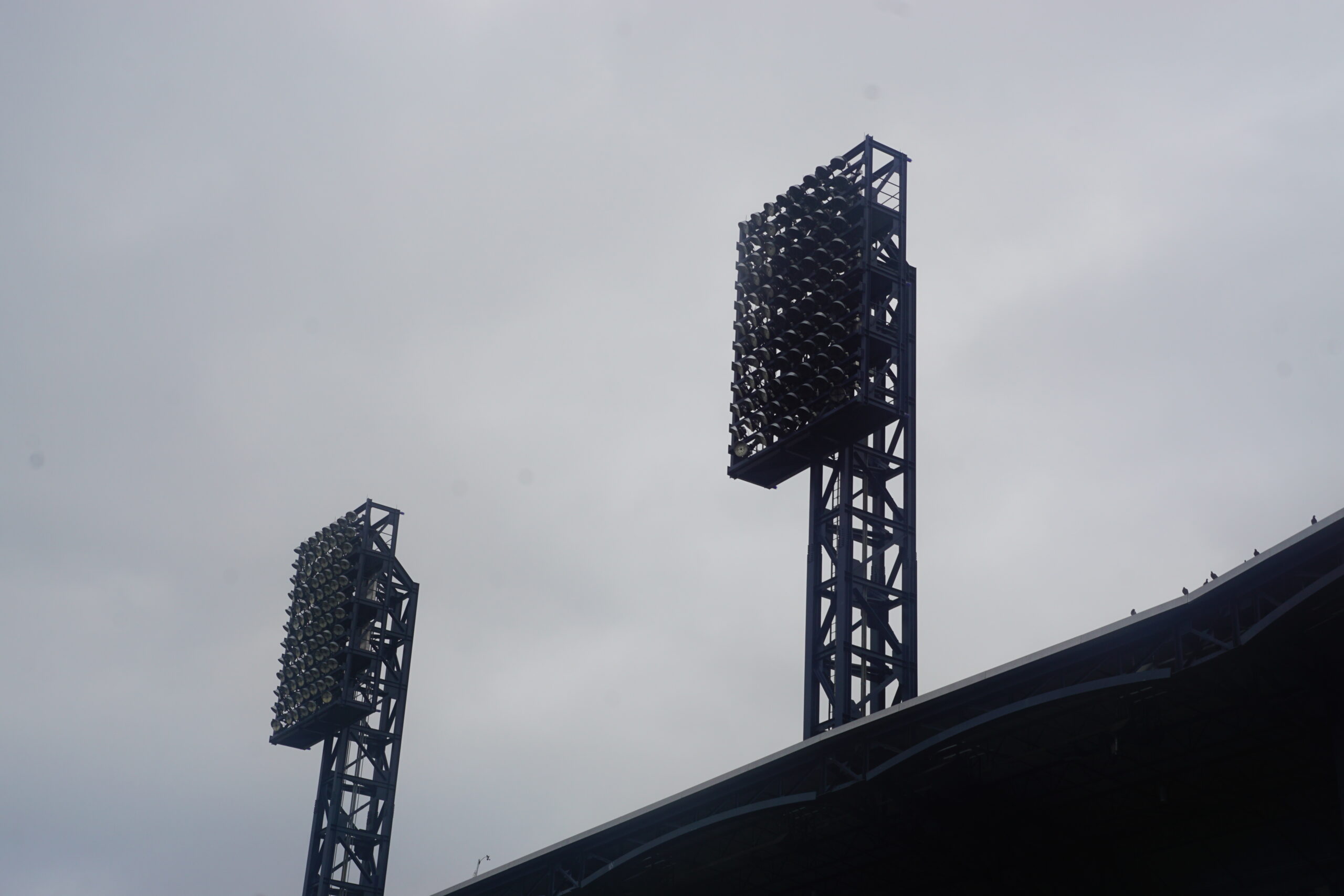 Stadium Lights, Game Day Connection Stadium lights above a ballpark, symbolizing game day excitement and fan connection